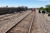 Young man and girl litter in front of train in Sikar