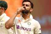 Virat Kohli kisses locket after scoring century know secret