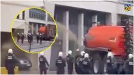 farmers spray Brussels police with liquid manure