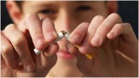 A Man Breaking A Cigarette