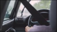 Man Driving A Car