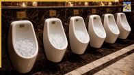 Why Luxury Hotels Put Ice Cubs in Urinals